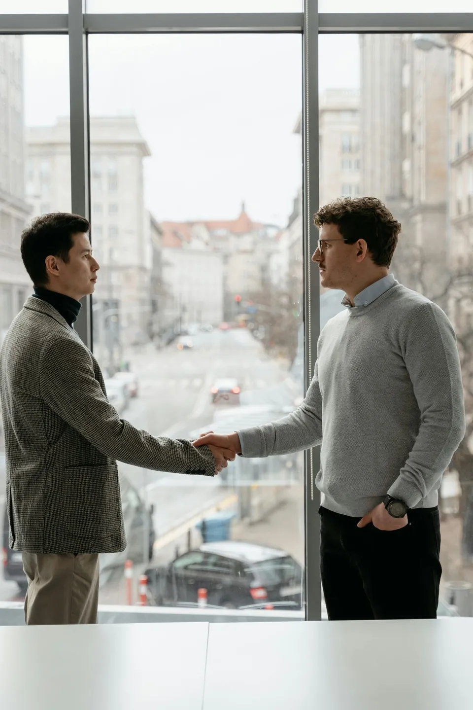 Business handshake — M&A deal in Uzbekistan